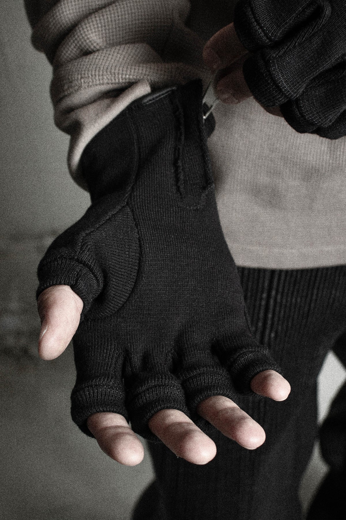 Palm side of the Ākhira Rib Glove, showing the hidden zipper at the wrist